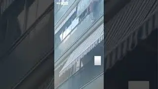 Bricklayer rescues boy hanging over balcony