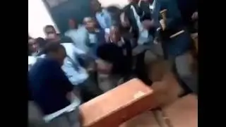 Kenyan high school boys dancing in class