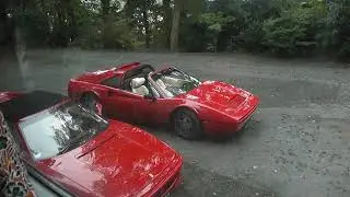 Ferrari parked next to coach,