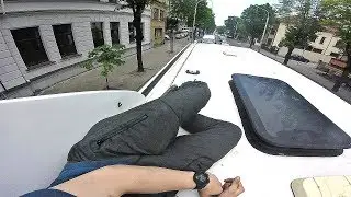 Hiding from angry drivers on top of bus