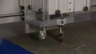 Cutting Carbon Innegra Triaxial with Nylon Black Veil by Vectorply with Eastman S125 static table