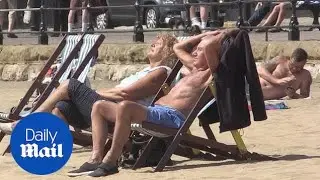 Sun seekers hit the beach in Scarborough as heatwave continues