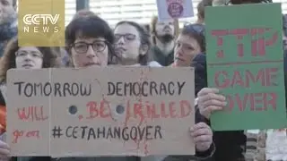 EU, Canada sign historic trade deal amid protests