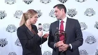Elizabeth Beisel talks with Coach of the Year Greg Meehan back stage at the Golden Goggle Awards
