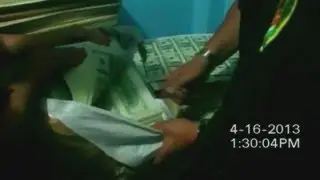 Police raid footage: $15 million in counterfeit US bank notes seized in Peru