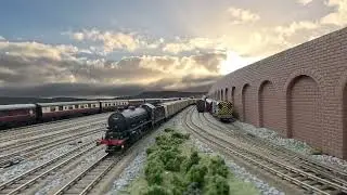Model railway, authentic squeaky clanking rolling stock, decent length trains, moving cloudy skies