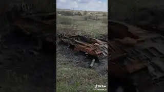 Ukranian soldier shows destroyed Russian T-80 tank