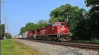 Shiny CP AC44CWM rebuild pair head east @ Romulus w/ CP Train 240