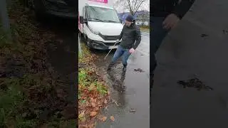 Unclogging a storm drain during rain #unclogging