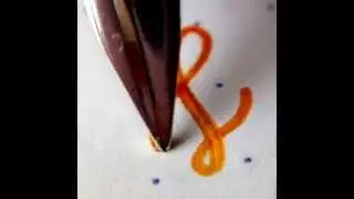 Rotring 600 fountain pen macro writing sample with Sailor Apricot ink on RHODIA dot pad