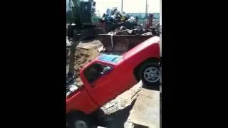 Truck rolls into scrap pile part 2