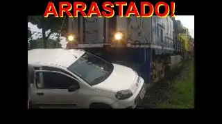CARRO FICA PRESO EM TRILHO E &Eacute; ARRASTADO POR TREM. VEJAM!