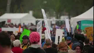 protestor swings a einstein facts matter sign at the march for science bfe