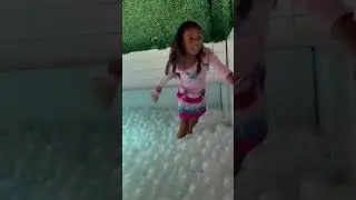 Playing at Barbie work ball pit
