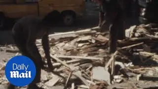 Debris cleared after car bomb explosion in Belfast in 1973 - Daily Mail
