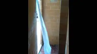 Simplicity: Dressing Room Curtain Caught in Breeze