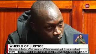 Six suspended police officers accused of illegal possession of firearms arraigned
