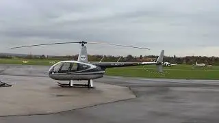 R44 D-HEOP departing at the station.