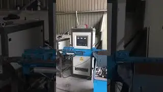 Induction heating machine with transmission cylinder for steel rods, iron bars, round metal