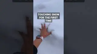 Filipina touching snow for the first time