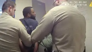 New video shows man accused of attacking district court judge spitting on corrections officer