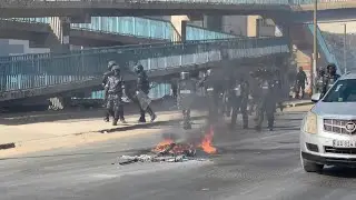 Protesters build barricades in Dakar as clashes follow Senegal election postponement | AFP