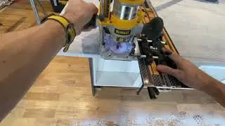 DeWalt DCW604 cordless router with guide rail