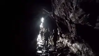 Coasteering - Exiting a sea cave. South Devon - Adventure South