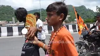 Kanwar Yatri Walks along the roadside during Kanwar Yatra in Haridwar