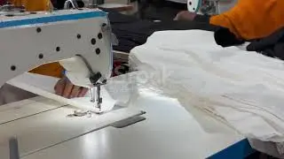 Close-Up Sewing Machine Stitching Fabric Inside Garment Factory in Bangladesh | 4K Stock Footage