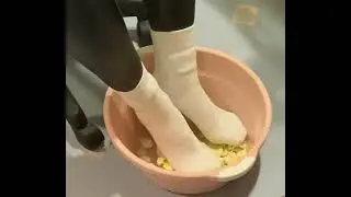 White socks crushing eggs. Leather pants