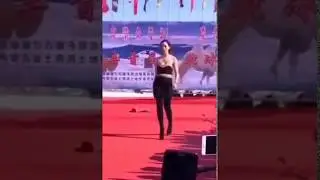 A Miss falls down in very high heels during Miss China 2018 Preliminary Competition