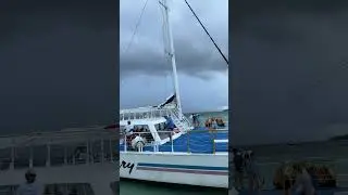 On a boat with thunderstorms in the distance. Leaving Fury Beach in Cozumel for the Disney Dream.