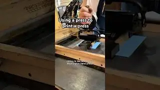 Using a tabletop printing press on a press to print an image of a printing press