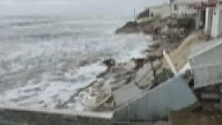 Tropical Storm Nicole topples beachfront homes