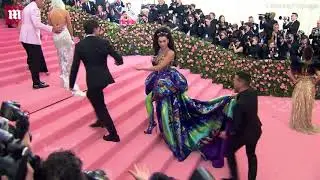 Dua Lipa arriving at the Met Gala 2019 wearing Atelier Versace