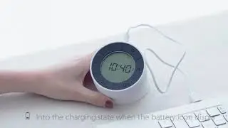 Digital alarm clock with reversible night light
