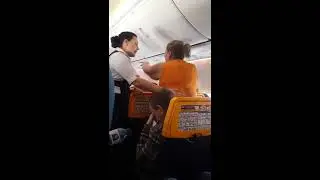 Drunk Irish woman epic meltdown on Ryanair flight screams you're the devil