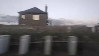 Blea Moor Signal Box and crossing Ribblehead viaduct on a class 158 in the early evening 