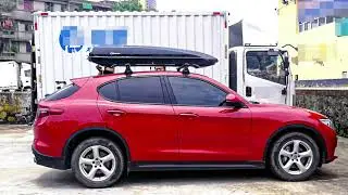 Alfa Romeo is installed with NEUMANN 305s roof rack + F5 roof box in black.