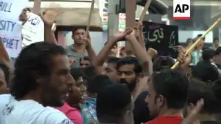 Demonstrators clash with police in protest over anti-Islam film
