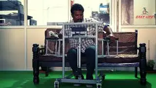 Electrically height adjustable commode transfer wheelchair