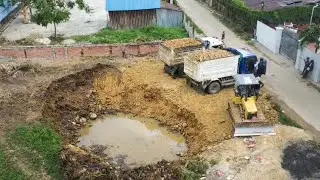 Small Equipments Filling Land In Village, Bulldozer And 5T Dump Trucks