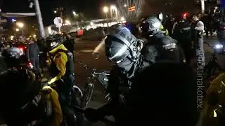 Portland police shove an angry mob back to clear the streets