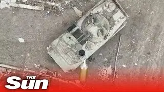 Ukrainian forces blow up Russian tank by dropping bombs into open hatch