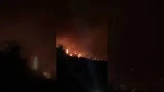 Knox Mountain on Fire in Kelowna live view looking Westwards from highway 97 August 18, 2023