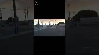 Union Pacific train passes near apartments and Metrolink train passes Chestnut in Santa Ana