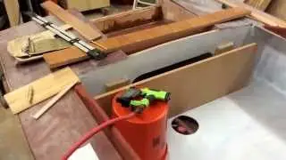 Boat building progress: trim work, seating, splash well venting