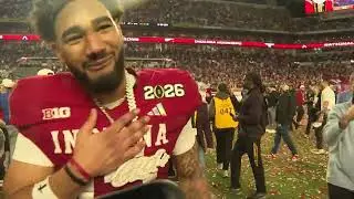Elijah Sarratt on field after winning National Championship