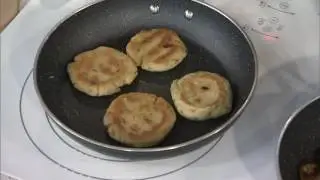 Classic Latin arepas dish topped with banana and avocado